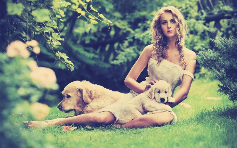 woman with dogs in garden