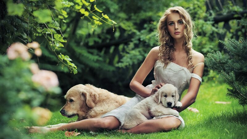 woman with dogs in garden