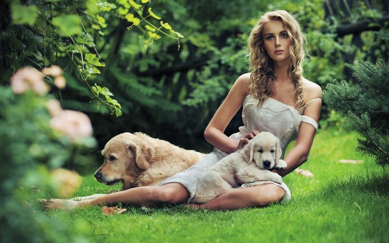 Woman with dogs in garden