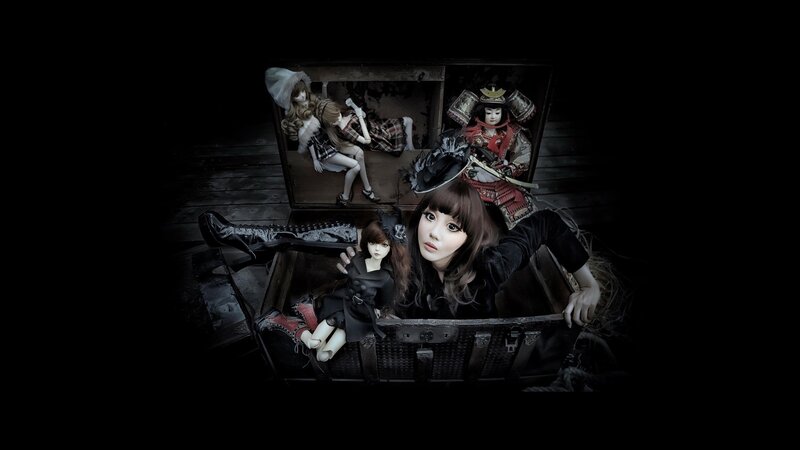 Woman with Dolls in Chest