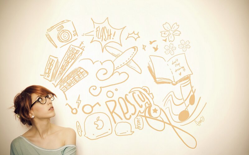 woman with doodles on wall