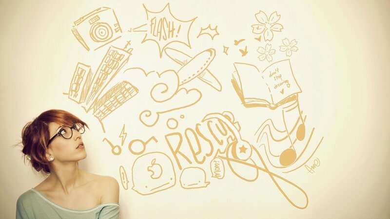 woman with doodles on wall