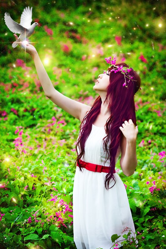 woman with dove in garden