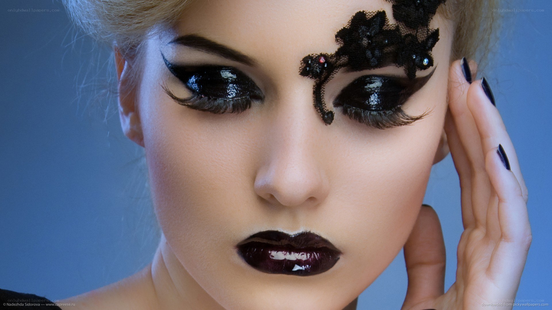 woman with dramatic black makeup