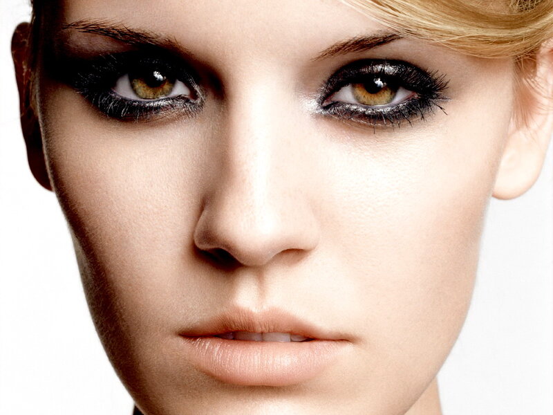 Woman with Dramatic Eye Makeup — White