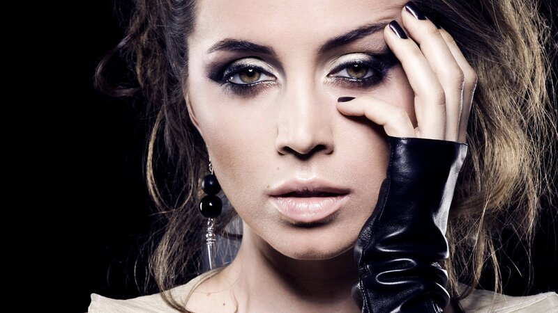 woman with dramatic makeup and black glove