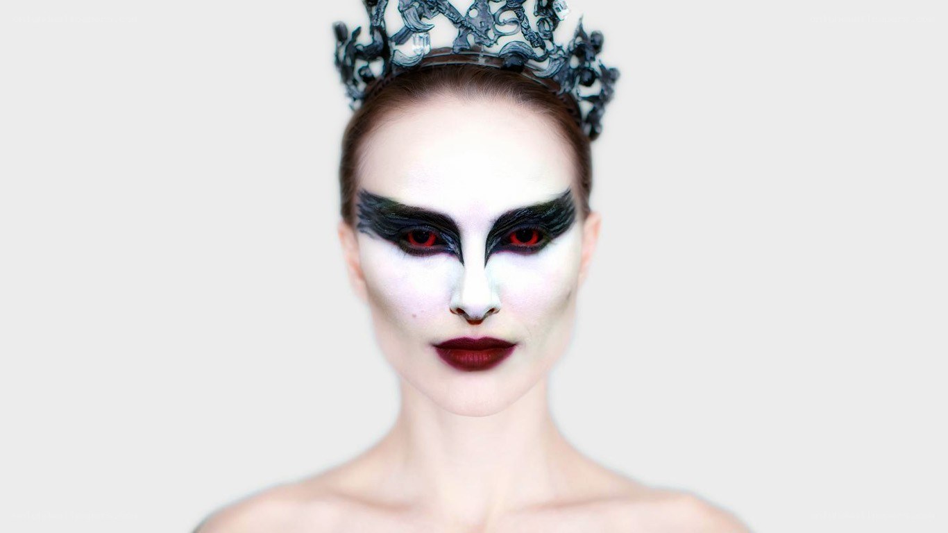woman with dramatic makeup and crown