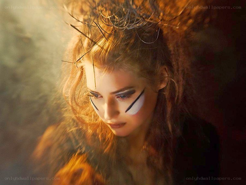 woman with dramatic makeup and crown