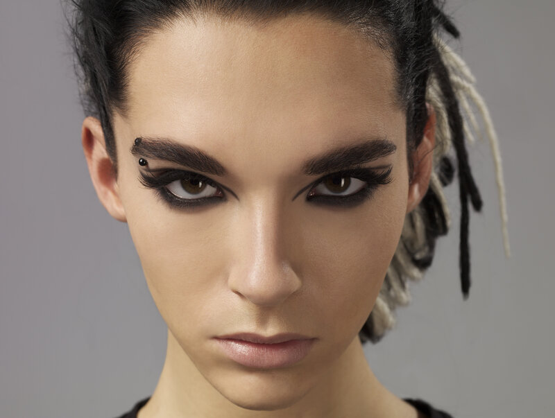 woman with dramatic makeup and dreadlocks