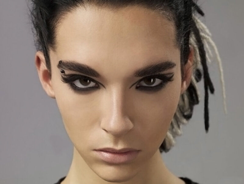woman with dramatic makeup and dreadlocks