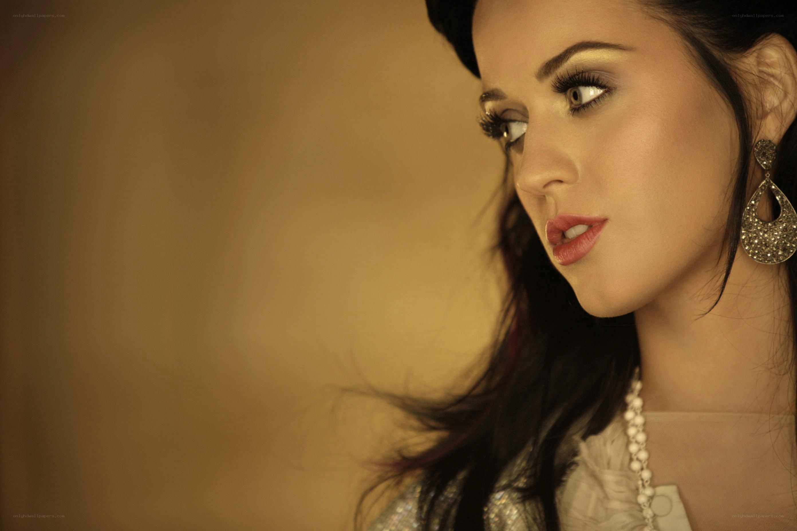 woman with dramatic makeup and earrings