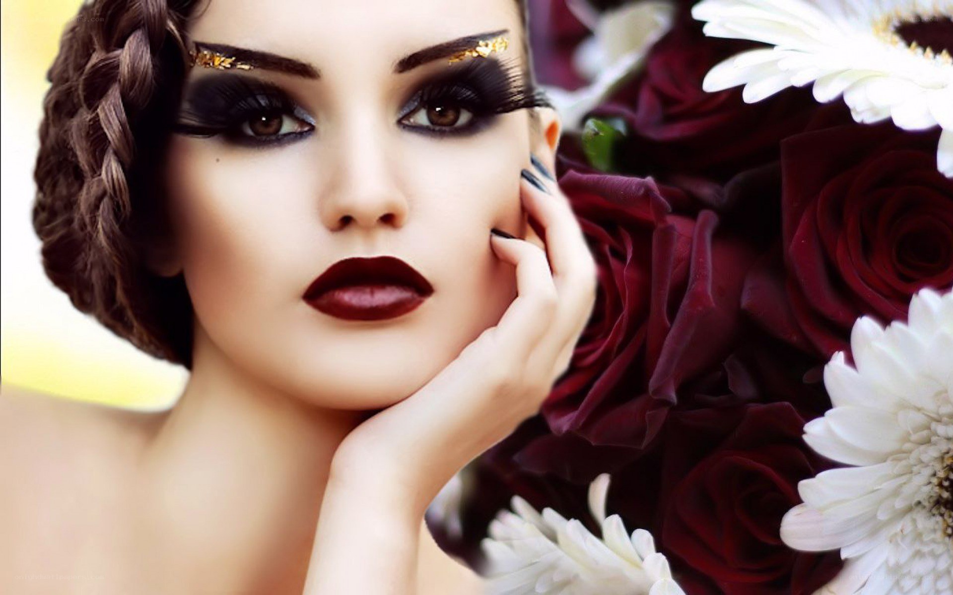 woman with dramatic makeup and flowers