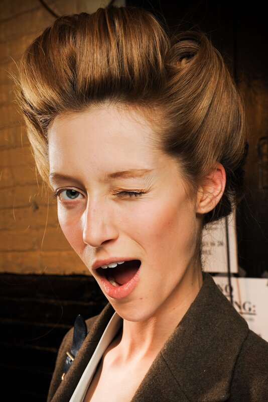 woman with dramatic makeup and hairstyle