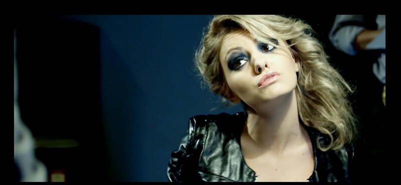 woman with dramatic makeup and leather jacket