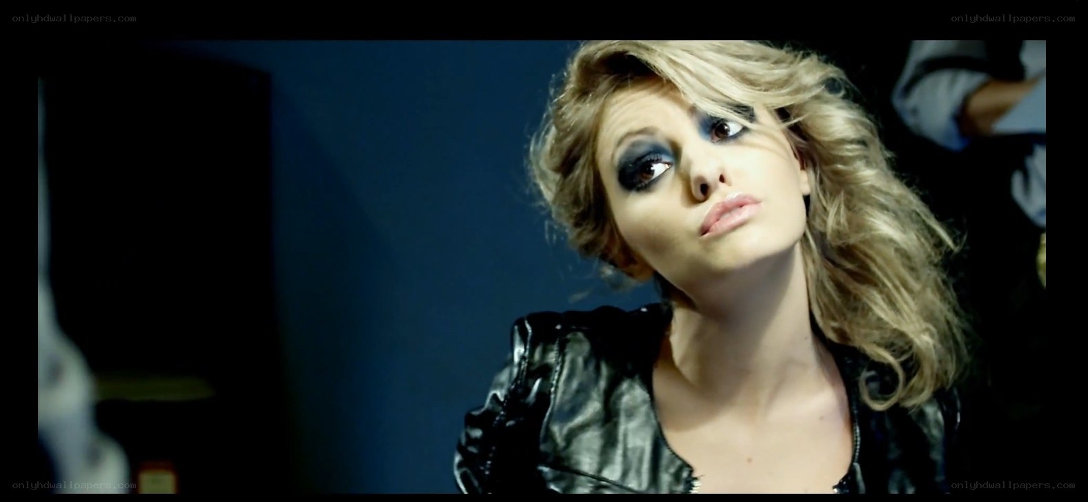 woman with dramatic makeup and leather jacket