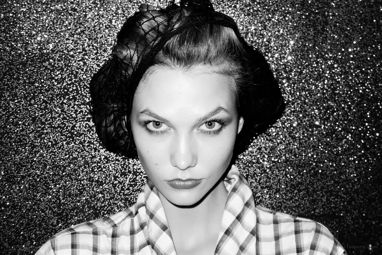 woman with dramatic makeup and net hat