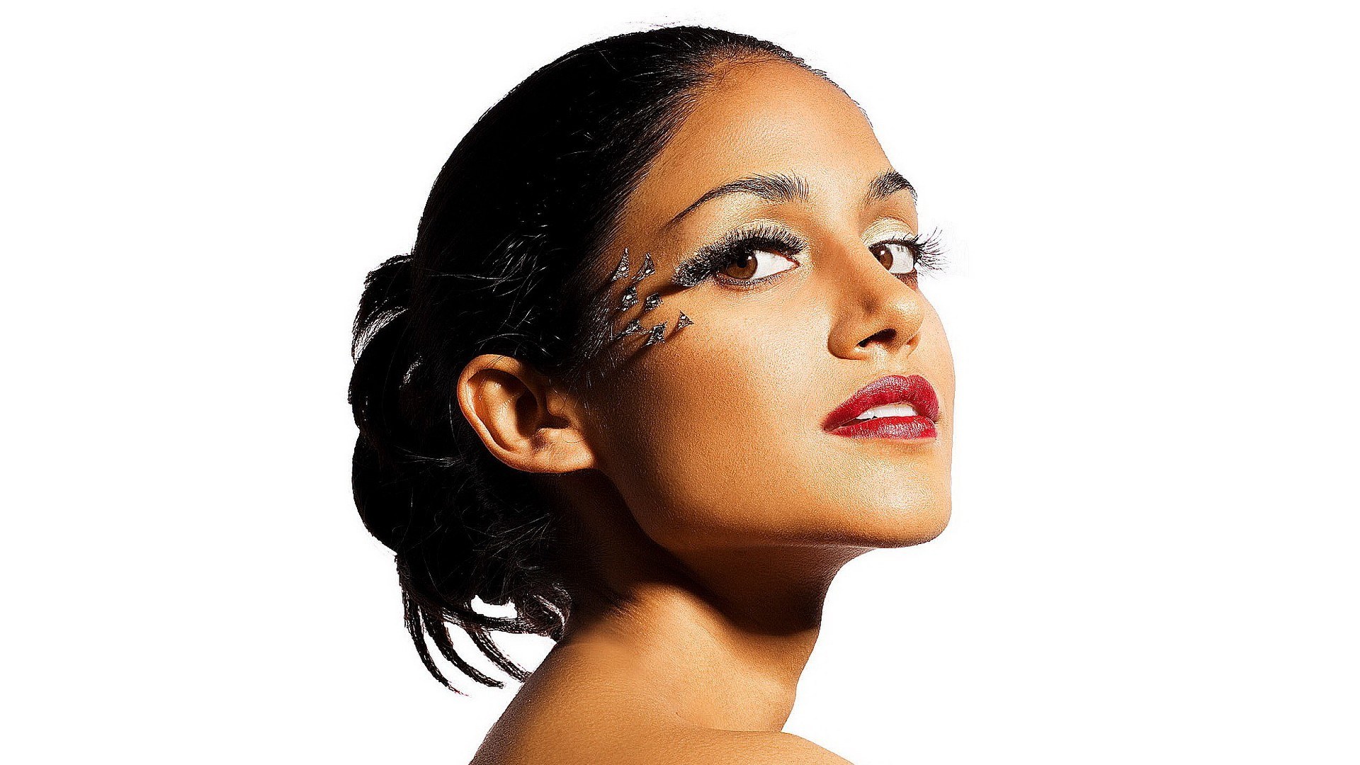 woman with dramatic makeup and red lipstick