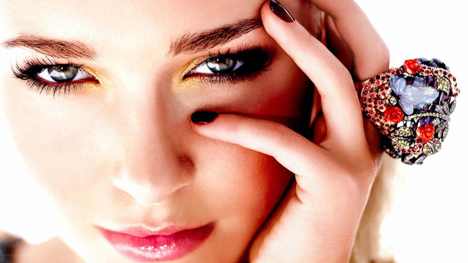 woman with dramatic makeup and ring