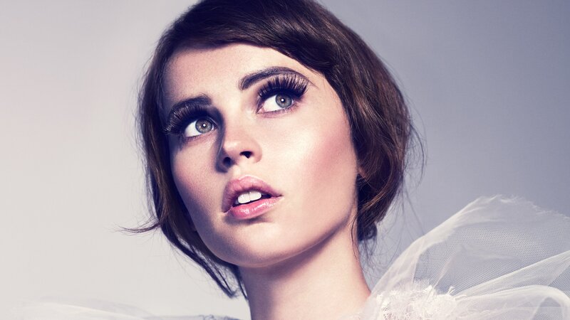 woman with dramatic makeup and tulle