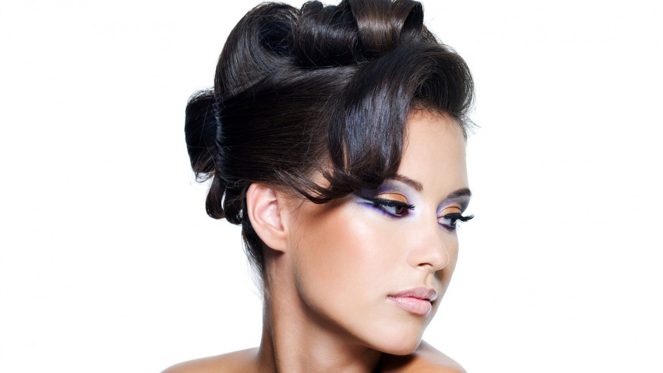 woman with dramatic makeup and updo