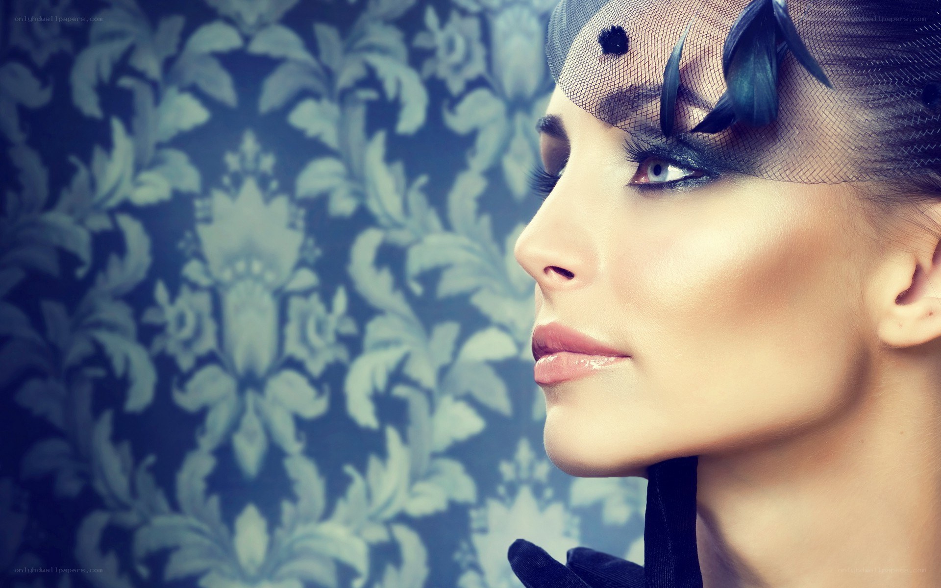 woman with dramatic makeup and veil