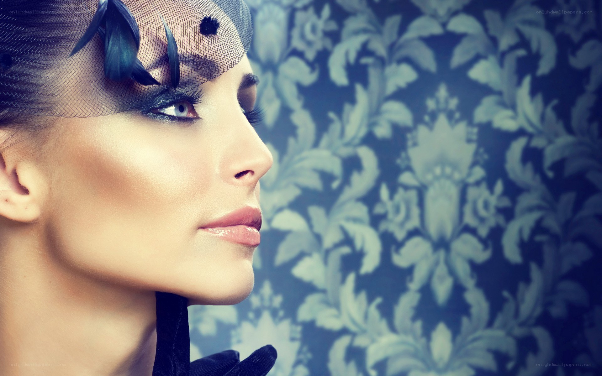 woman with dramatic makeup and veil