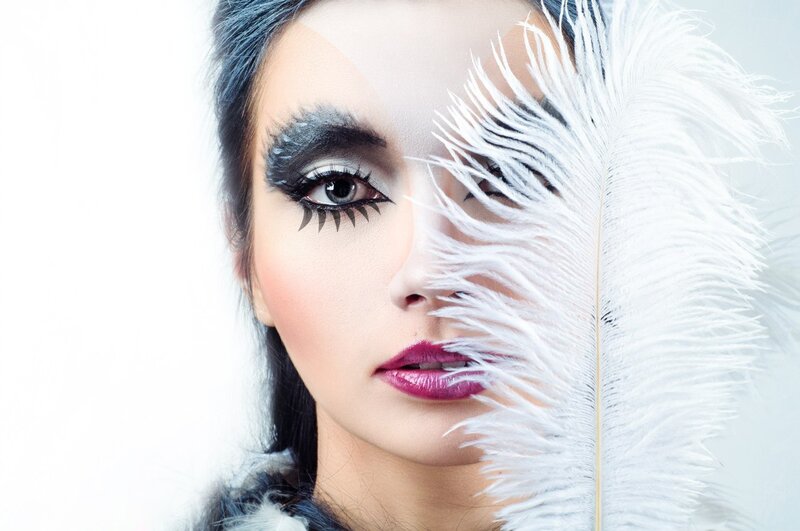 Woman with Dramatic Makeup — White, Photograph, Feather