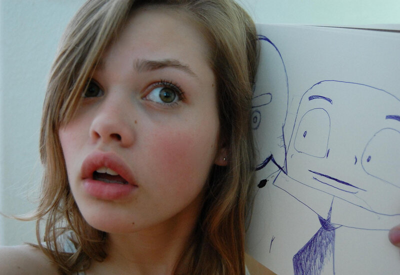 woman with drawing behind her