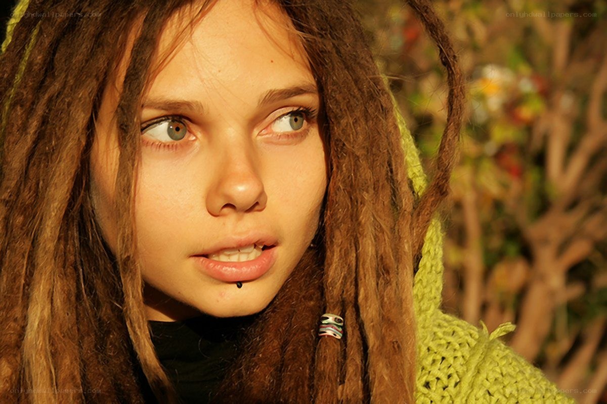 woman with dreadlocks and lip piercing