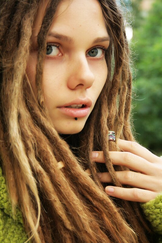 woman with dreadlocks and lip piercing