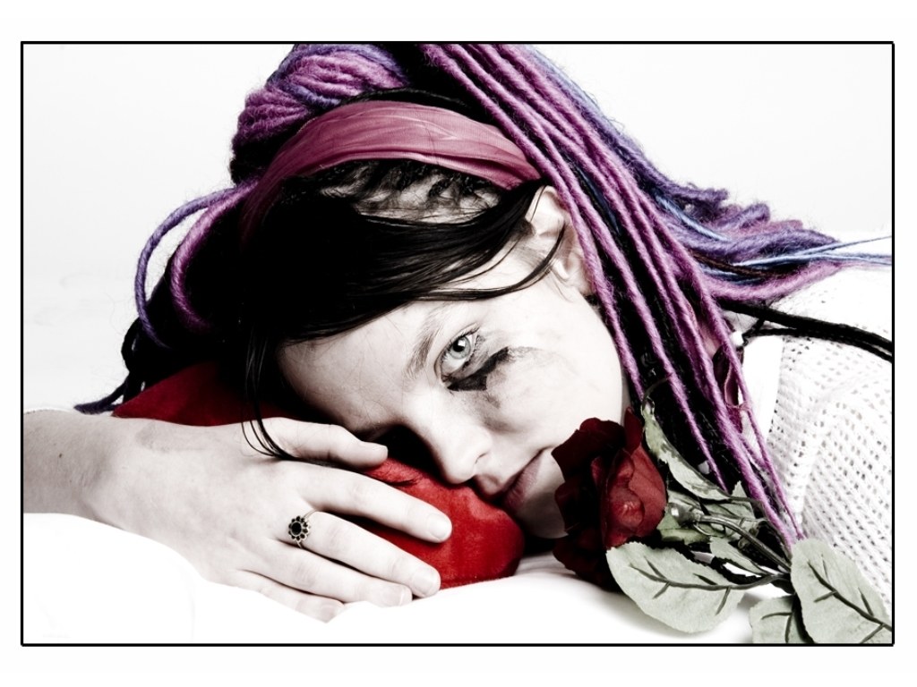woman with dreadlocks and rose
