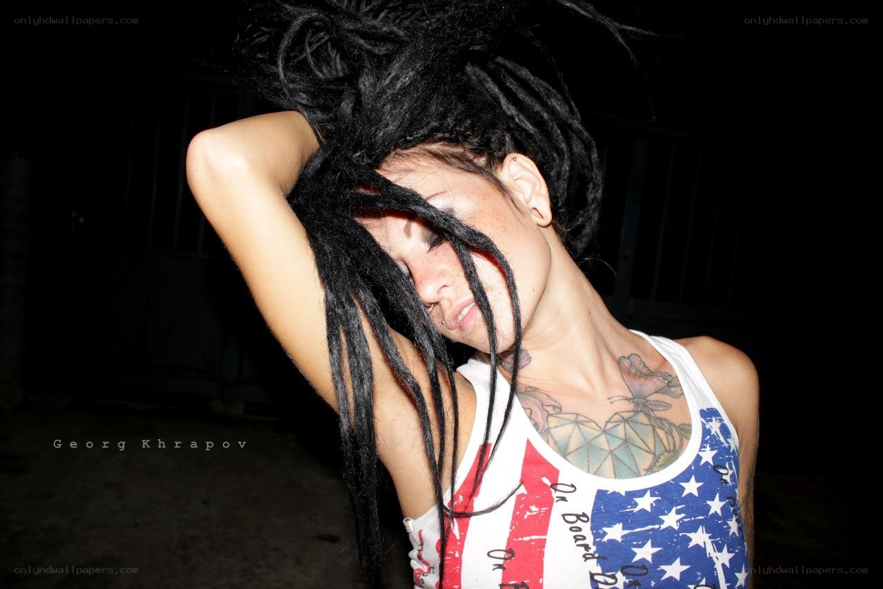 woman with dreadlocks and tattoos