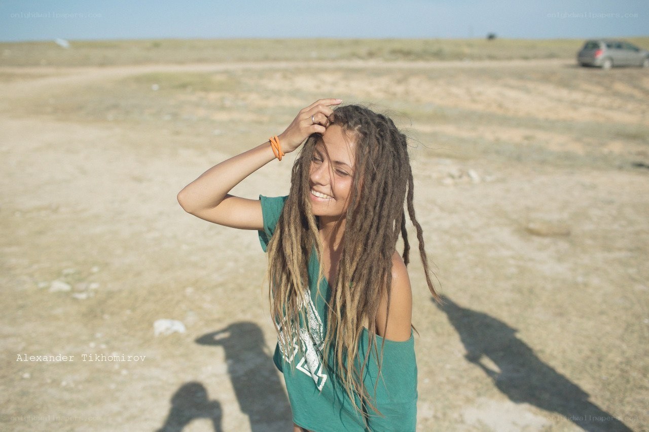 woman with dreadlocks in desert