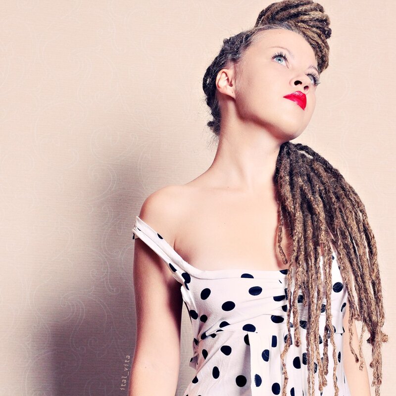 woman with dreadlocks in polka dot dress