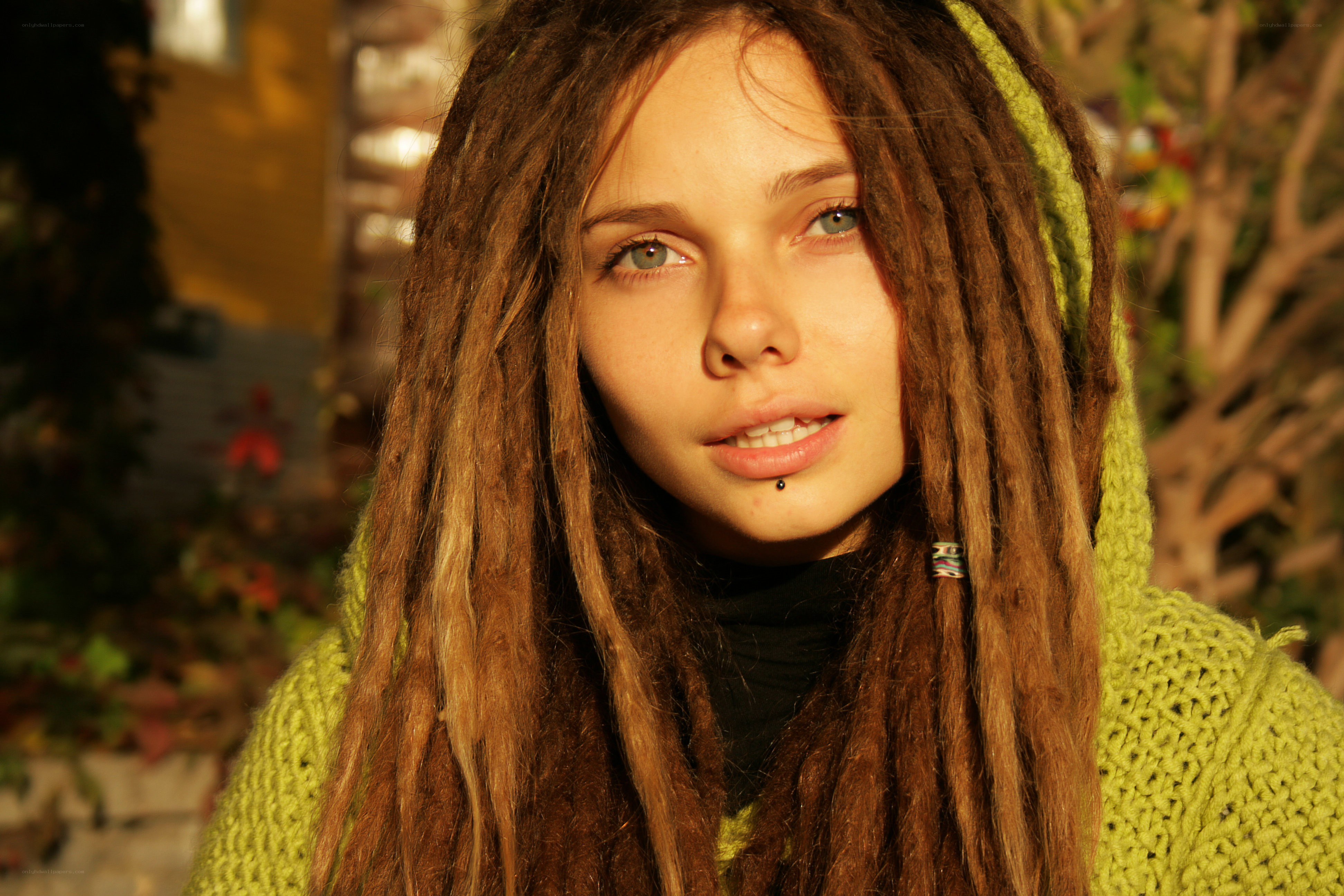 woman with dreadlocks in sunlight