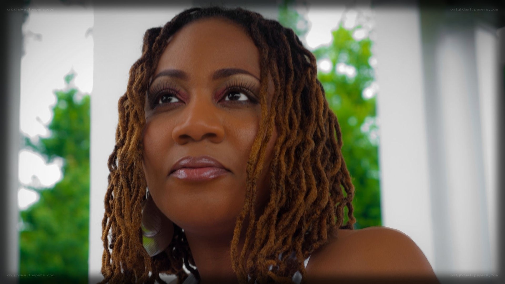 woman with dreadlocks looking up