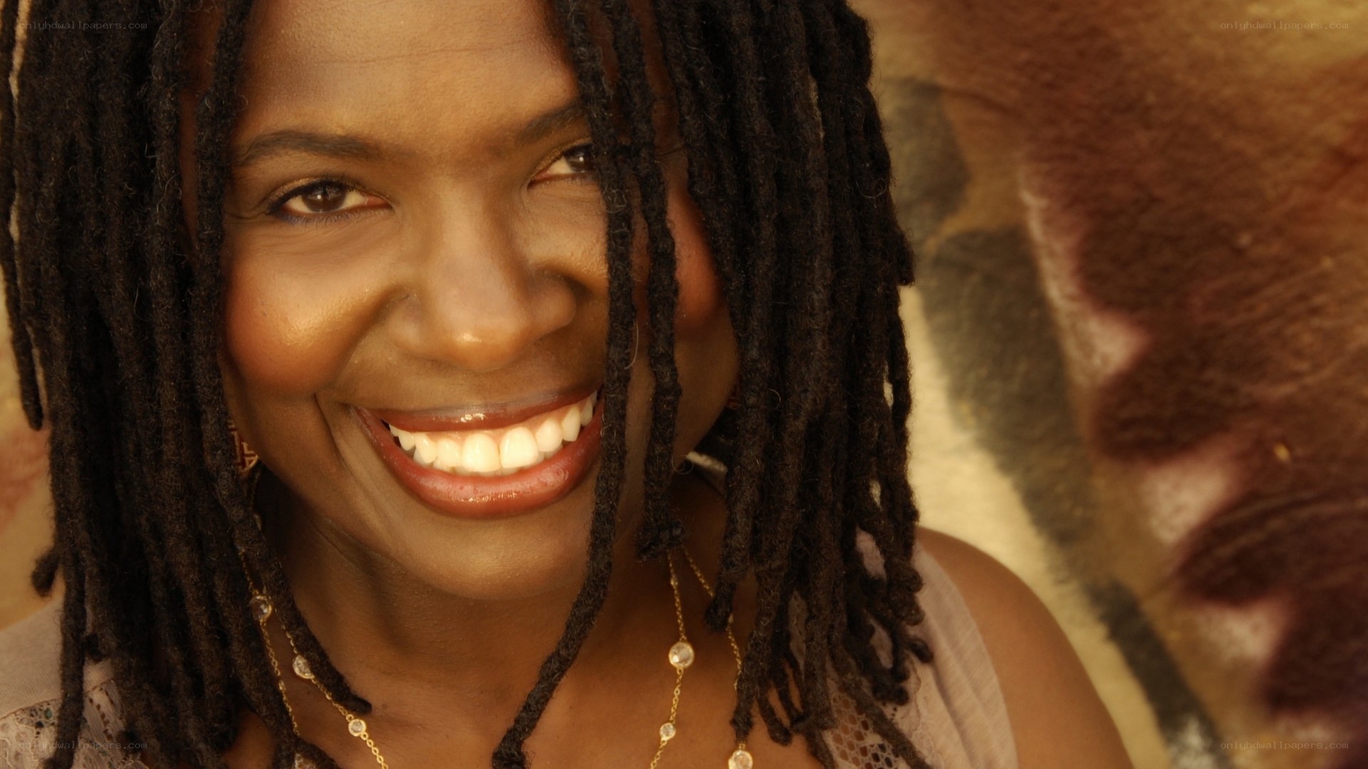 woman with dreadlocks smiling
