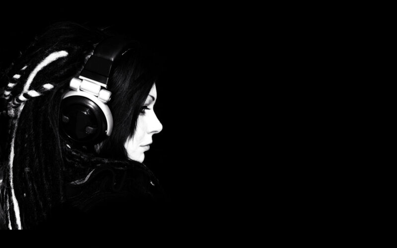 woman with dreadlocks wearing headphones