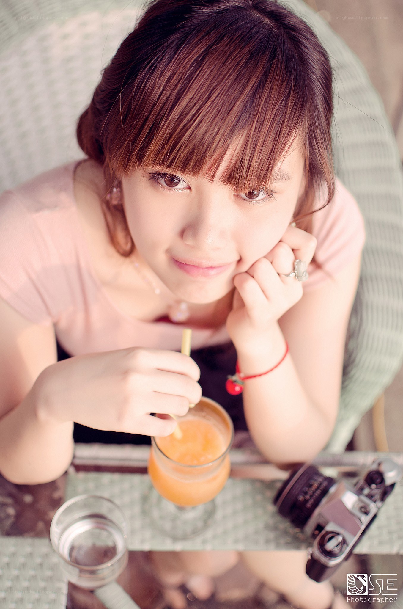 woman with drink at table