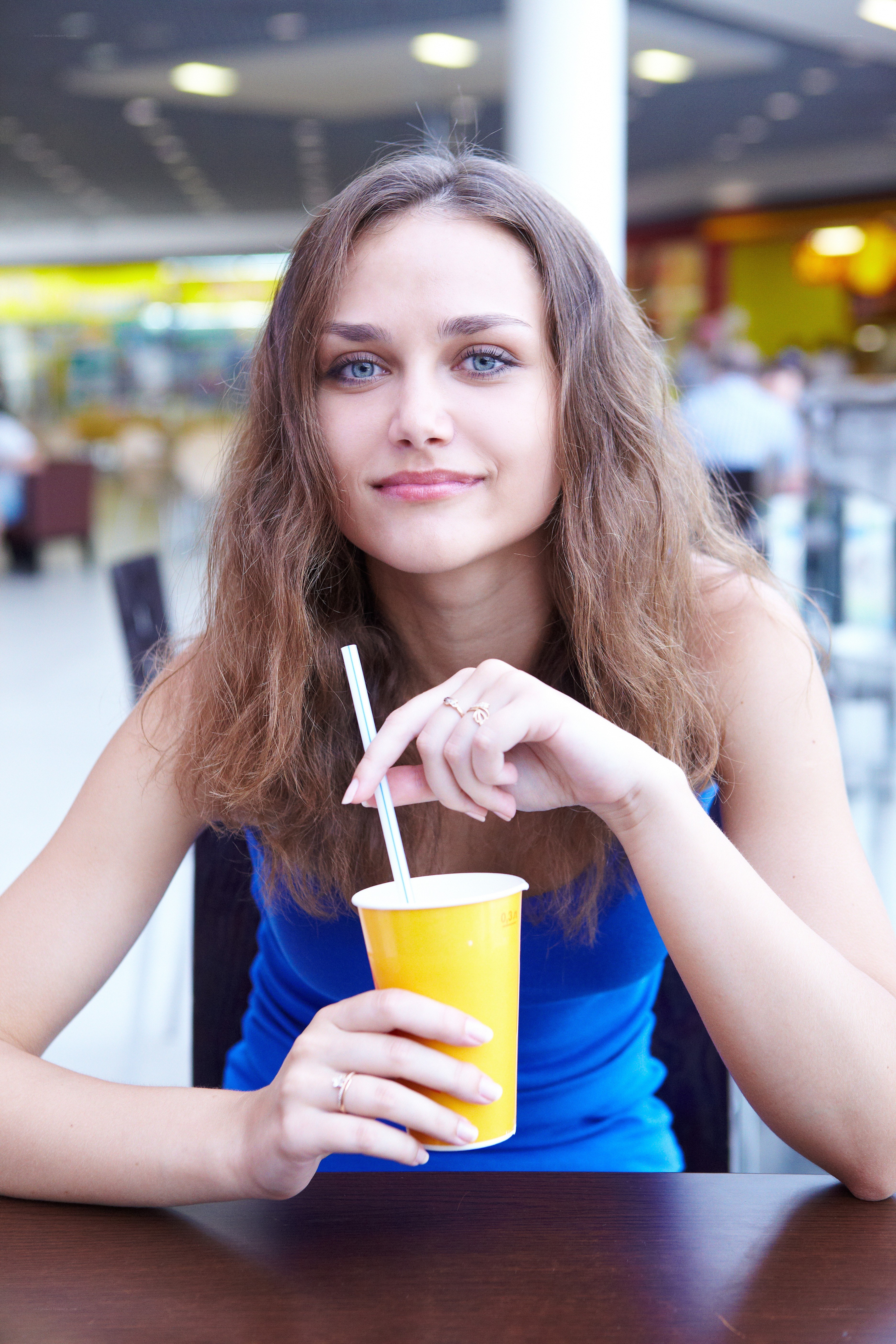 woman with drink at table