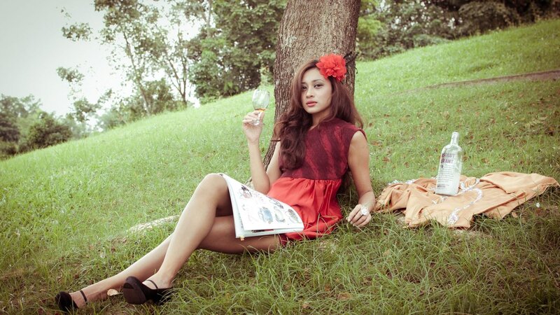 Woman with drink in park