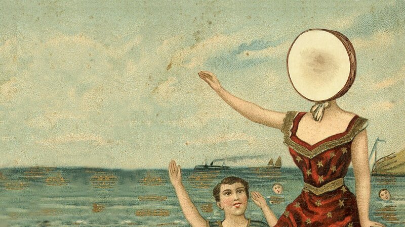 woman with drum head on beach