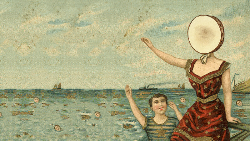 woman with drum head on beach