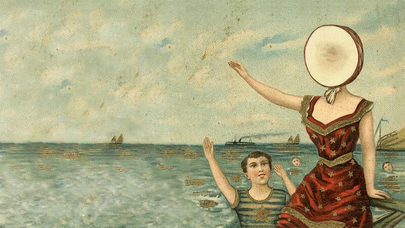 Woman with drum head on face