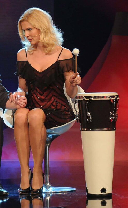 Woman with drumstick on stage