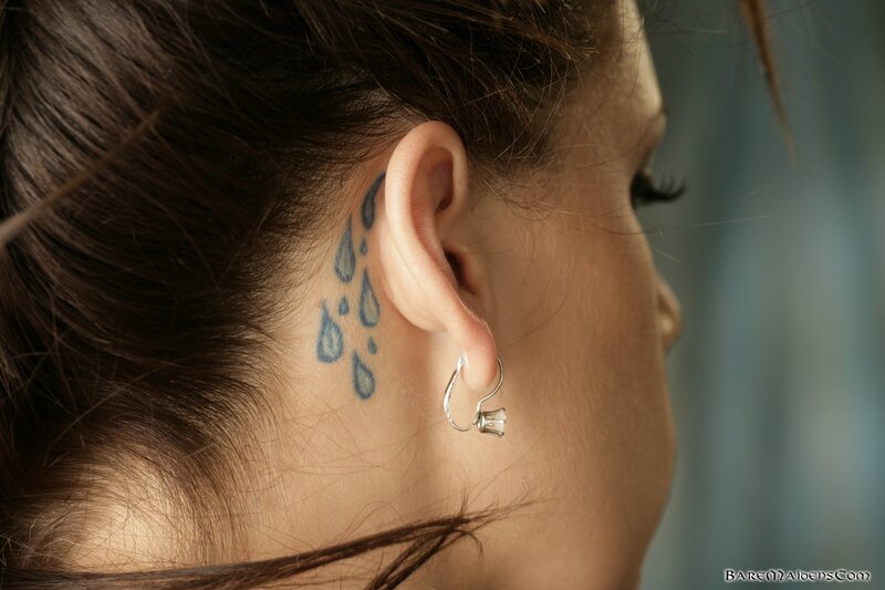 woman with ear tattoo