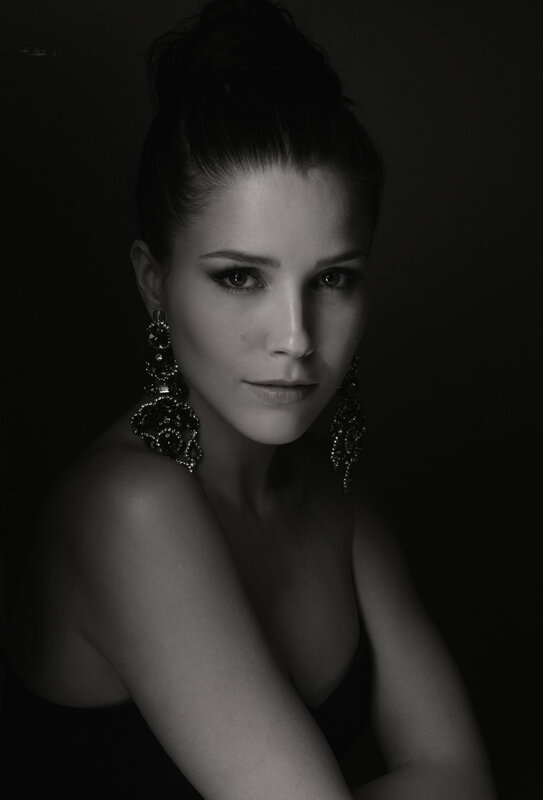 Woman with Earrings — Black, Dramatic, Photograph, Hair Bun