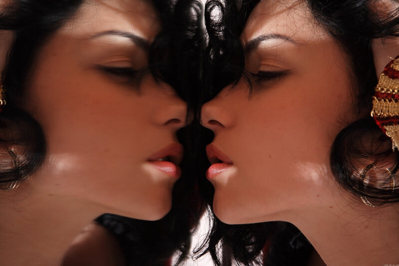 woman with earrings in mirror