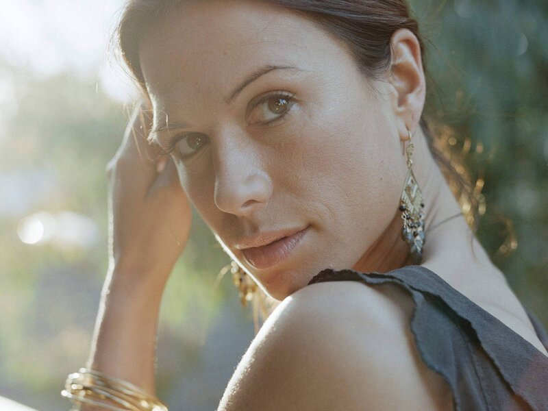 woman with earrings in sunlight