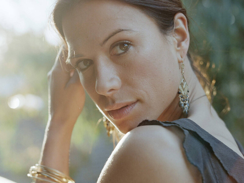 woman with earrings in sunlight